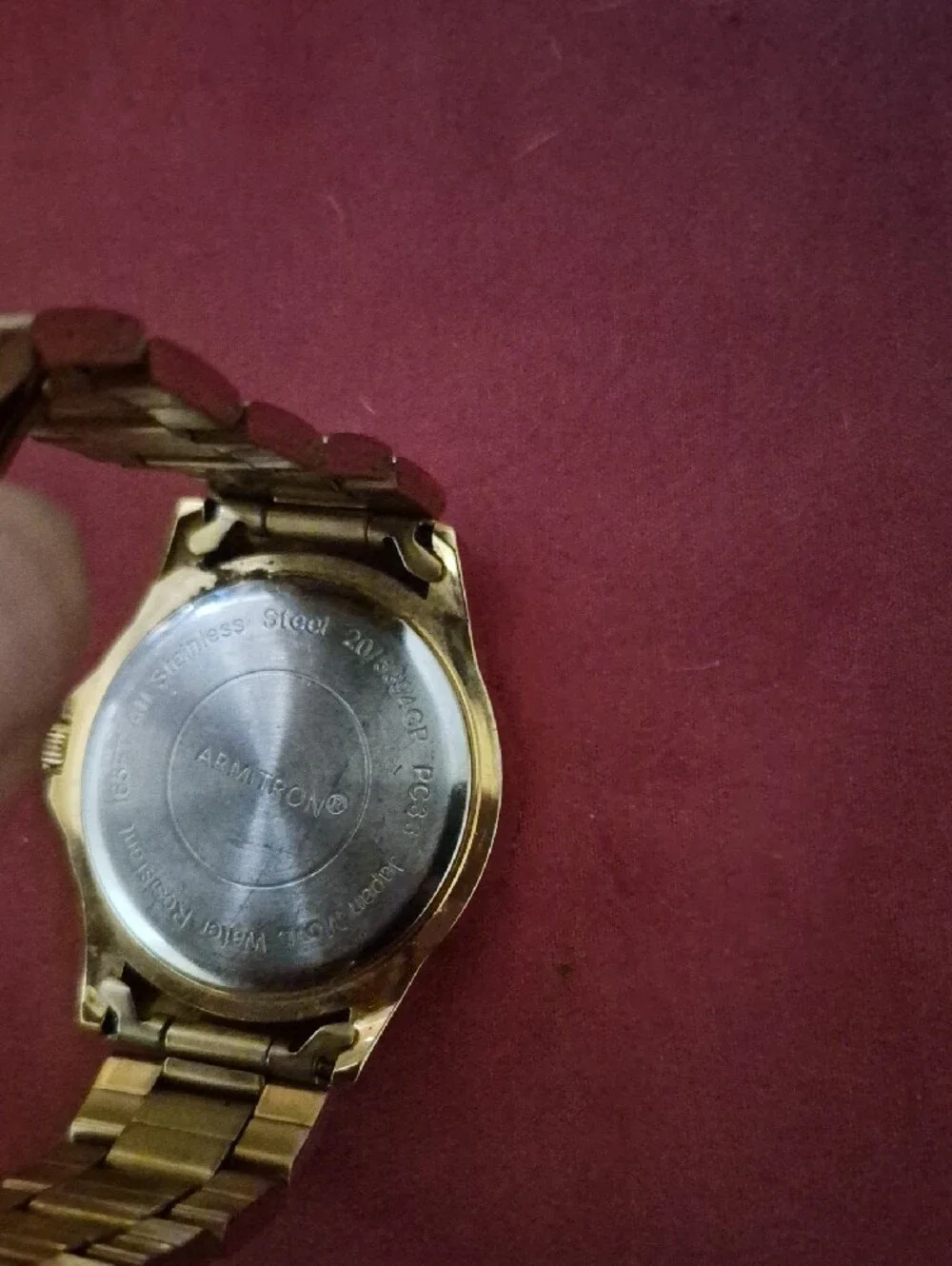 Armitron Gold-Tone Watch with Black Dial and Day-Date